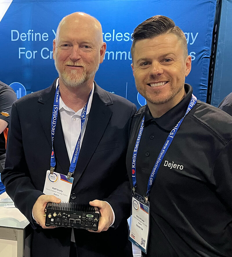 Dejero’s Matt Scully and Rory McCabe holding a Dejero GateWay 3220.