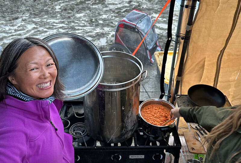 Mei selfie front of some pots cooking at Burning Man