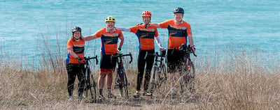 Spinning Wheels Tour cyclists ocean image