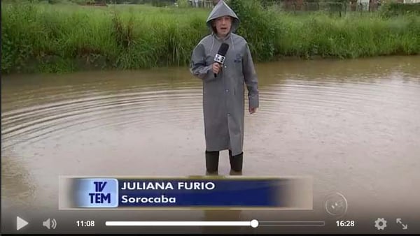 TV TEM journalist going live in a flood with Dejero